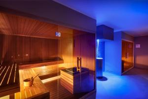 a room with a sauna with a blue light at Hotel Ambasador - Liburnia in Opatija