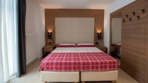 Postel nebo postele na pokoji v ubytování Hotel Bellevue
