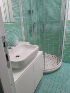 a bathroom with a sink and a shower at Villetta Reparata in Santa Teresa Gallura