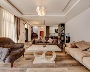 a living room with a couch and a table at Villa Una in Kotor