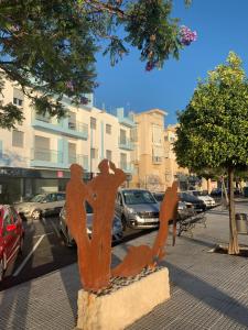 a statue of people standing on a street at Apartamento Sorolla Center in Ayamonte