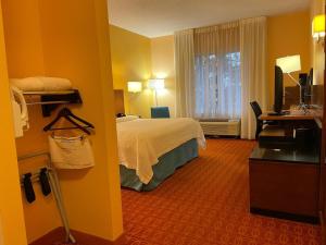 a hotel room with a bed and a window at Baymont by Wyndham Chambersburg in Chambersburg +38 photos