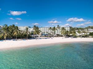 a view of a resort from the beach at Coconut Court Beach Hotel in Bridgetown