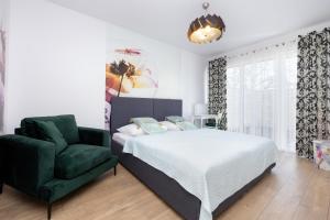 เตียงในห้องที่ Jantar Apartamenty - Biały Dom