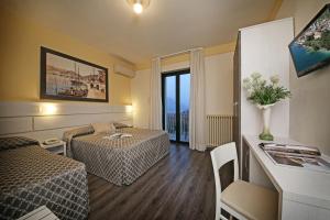 TV a/nebo společenská místnost v ubytování Hotel Panoramica