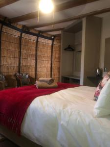 Un pat sau paturi într-o cameră la Jock of the Bushveld