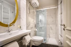 a bathroom with a sink toilet and a shower at Villa Abbazia - Liburnia in Opatija