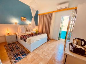 Postel nebo postele na pokoji v ubytování El Gezira Hotel
