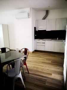 a kitchen and dining room with a table and chairs at La Casetta in La Spezia