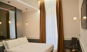 Postel nebo postele na pokoji v ubytování Hotel Giotto Flavia