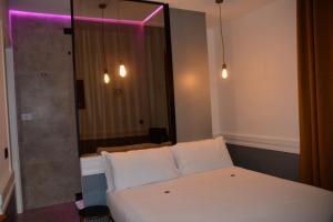Postel nebo postele na pokoji v ubytování Hotel Giotto Flavia