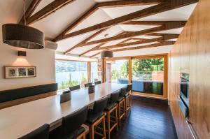 a dining room with a long table and chairs at Chalet Max Panorama by we rent in Zell am See