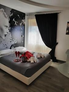 a bedroom with a bed with a table with wine glasses at Caos Calmo in Rome