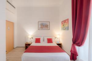 Postel nebo postele na pokoji v ubytování Hotel Giotto Flavia