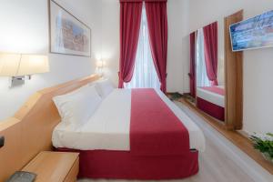 Postel nebo postele na pokoji v ubytování Hotel Giotto Flavia