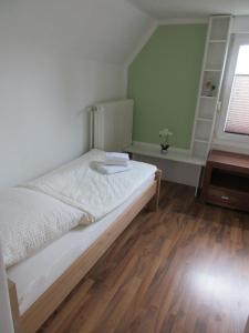 Postel nebo postele na pokoji v ubytování Ferienhaus Weitblick