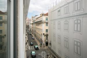 a view of a city street from a window at Downtown Sleek Apartment 65 by Lisbonne Collection in Lisbon