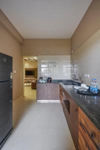 O bucătărie sau chicinetă la Sanctum Luxury Serviced Apartments