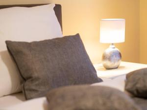 Postel nebo postele na pokoji v ubytování Kaiservillen Heringsdorf - Ferienwohnung mit 1 Schlafzimmer und Balkon D224