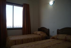 Postel nebo postele na pokoji v ubytování Apartamentos Los Saltos