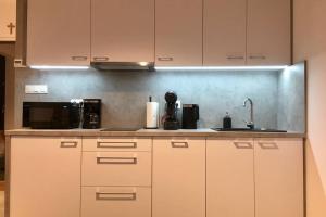 Η κουζίνα ή μικρή κουζίνα στο Apartament Fibra Brownie