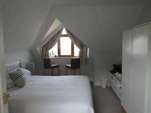 Postel nebo postele na pokoji v ubytování Seafort Luxury Hideaway