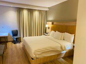 Letto o letti in una camera di Radisson Colon 2,000 Hotel & Casino