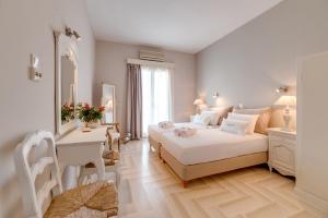 Ένα ή περισσότερα κρεβάτια σε δωμάτιο στο Anna Platanou Hotel
