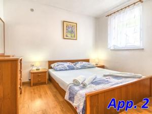 Krevet ili kreveti u jedinici u objektu Apartment in Medulin with sea view, terrace, air conditioning, Wi-Fi (4635-2)