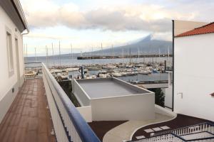 a balcony with a view of a marina at Faial Marina Apartments 2 in Horta