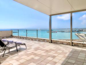 a balcony with a view of the ocean at Cofradia Penthouse in Alcudia