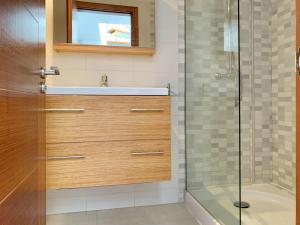 a bathroom with a sink and a shower at Cofradia Penthouse in Alcudia