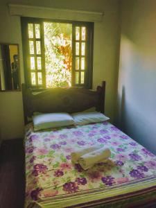 Säng eller sängar i ett rum på Ilha Grande - Casa Praia da Longa