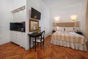 Posteľ alebo postele v izbe v ubytovaní Casa Dei Fiori