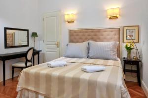 Posteľ alebo postele v izbe v ubytovaní Casa Dei Fiori