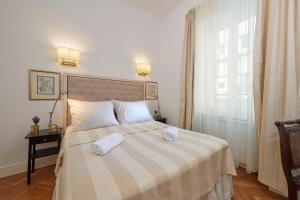Posteľ alebo postele v izbe v ubytovaní Casa Dei Fiori
