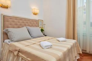 Posteľ alebo postele v izbe v ubytovaní Casa Dei Fiori