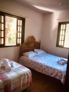 Giường trong phòng chung tại Ilha Grande - Casa Praia da Longa