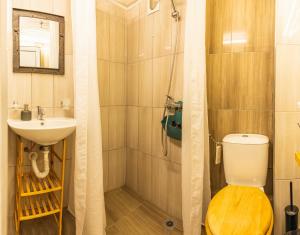 a bathroom with a shower and a toilet and a sink at Urban style in the Centre in Varna City