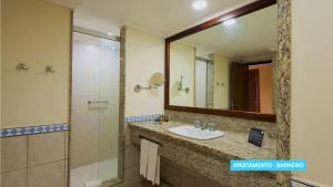 
a bathroom with a sink and a mirror at Vila Galé Eco Resort do Cabo - All Inclusive in Cabo de Santo Agostinho
