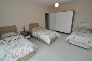Postel nebo postele na pokoji v ubytování Dekar Apartments