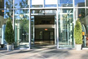 an entrance to a glass building with a revolving door at Avalon in Syktyvkar