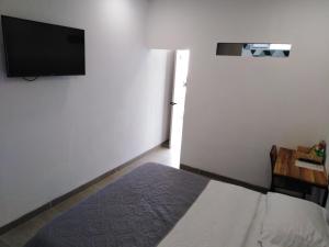 Postel nebo postele na pokoji v ubytování Hotel HACIENDA SAN AGUSTIN