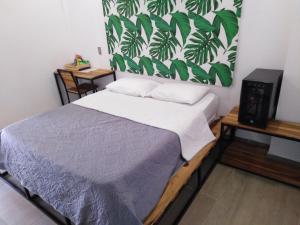 Postel nebo postele na pokoji v ubytování Hotel HACIENDA SAN AGUSTIN