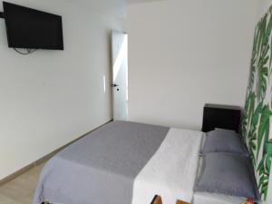 Postel nebo postele na pokoji v ubytování Hotel HACIENDA SAN AGUSTIN