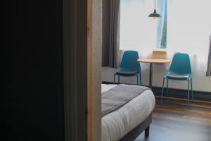 Postel nebo postele na pokoji v ubytování Adrift Hotel