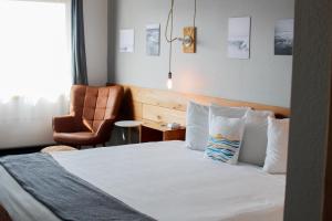 Postel nebo postele na pokoji v ubytování Adrift Hotel