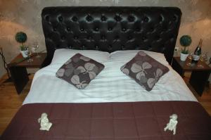Una cama o camas en una habitación de Guest House Maja