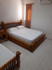 Tempat tidur dalam kamar di Hotel Cartagena Airport