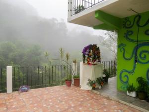 a balcony of a house with a view at Casa Verde Xilitla By Rotamundos in Xilitla